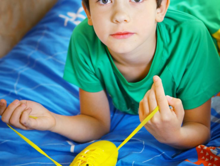 boy laying on bed - dealing with ungrateful children