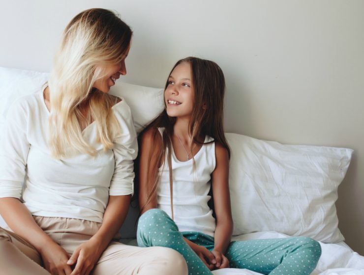 mum and daughter sitting together talking about positive body image